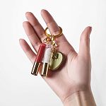 Фото Золотой брелок с блесками для губ 2